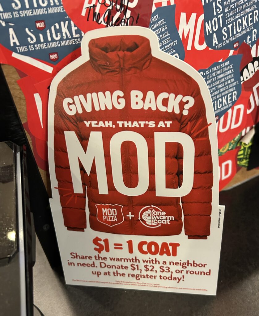 An advertisement from MOD Pizza, a red coat with the words "Giving Back? Yea, that's at MOD" with donation amounts available.